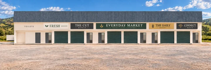 Artist’s impression of the completed front of shop block 2 at Thornville Junction with illustrative half-shop and full-shop signs; names are examples, not current tenants or a current site photograph